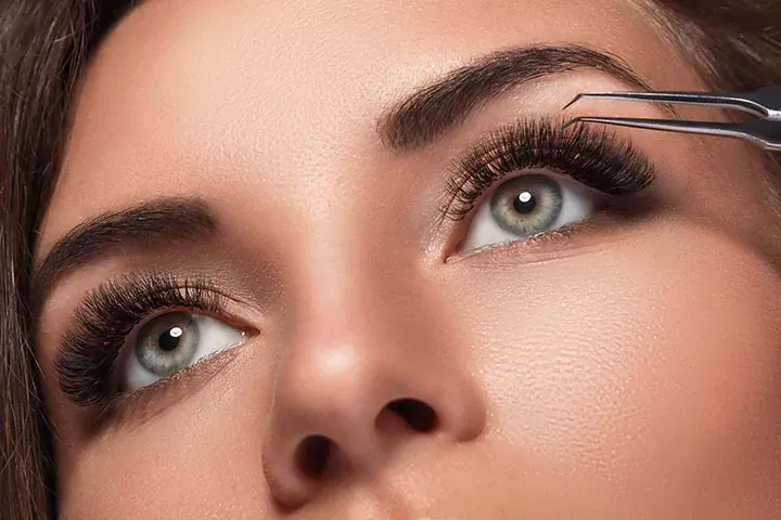 Close-up of eyes with voluminous lash extensions during a 2-week fill